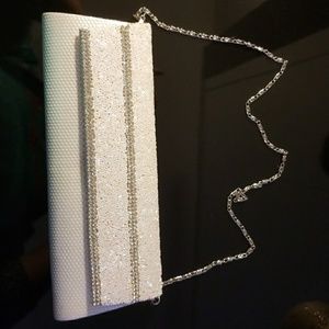 White and silver clutch.